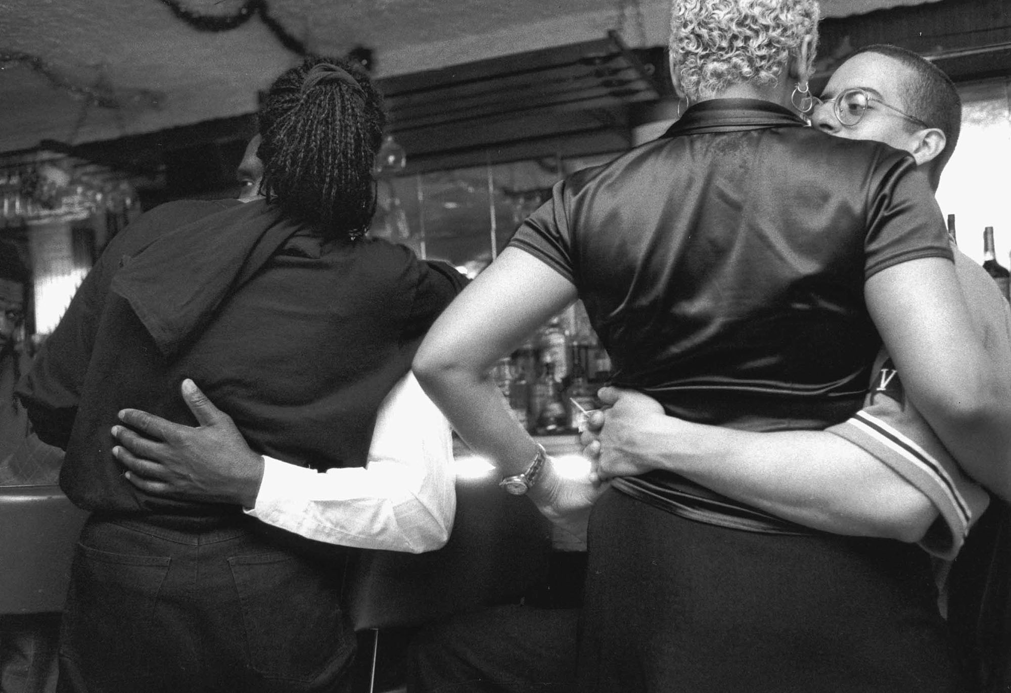 Gerald Cyrus, Two Couples, Arms Around, St. Nick's Pub, 1998. Gelatin silver print. Courtesy of the artist.